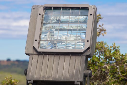 Big spotlight for public building on nature. Halide lamps with mercury ballast