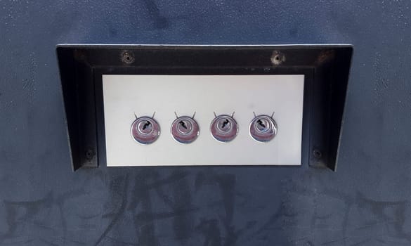 4 key holes protected with metal roof. Automatic parking barrier device