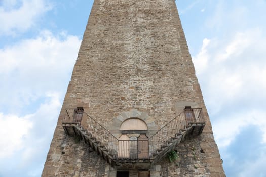 Exterior of antique tower building with Escher architecture style. Simmetry and geometric perspective.