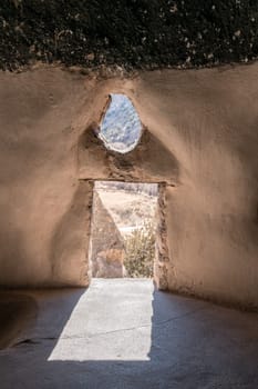 A view from inside of cavate - a natural cavity in the cliff expanded by the dwellers. Bandelier National Monument, New Mexico