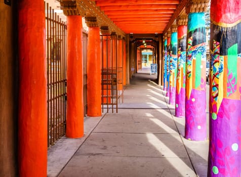 Brightly painted colonnade in central plaza in Santa Fe, New Mexico