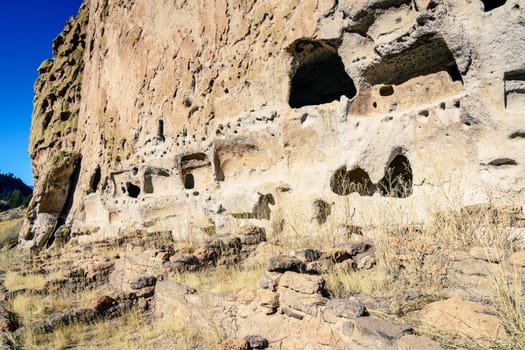 Main cliff at Bandelier National Monument, showing both cave dwellings and external dwelling ruins