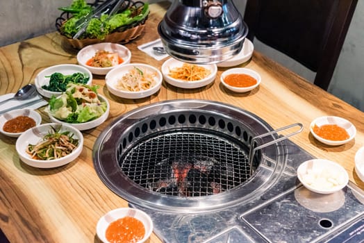 Spicy Kimchi group. Korean pickle or Pickled radish vegetables set and seasoning on bowl on stove serve wood table background, Japanese food