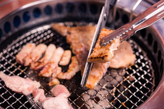 Korean beef barbecue on hot coals. Ready for grilling meat pork Korean BBQ traditional style on stove serve in restaurant, Japanese food