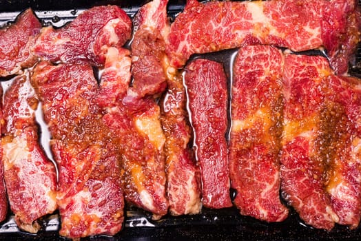 Raw pork on plate, Korean traditional style fresh pork beef belly BBQ, Japanese meat hot pot or Shabu in the restaurant, barbecue food
