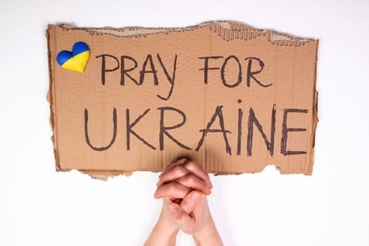 Pray for Ukraine concept background. Concept symbol of help support and no war in the country of Ukraine.