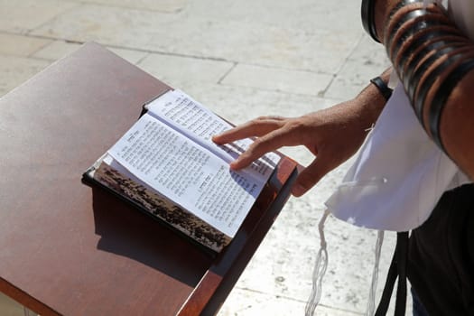 Reading the Hebrew Bible at the Wailing Wall in Jerusalem. Israel