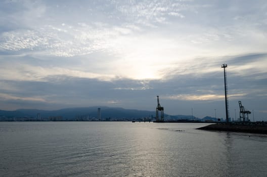 Container terminal port in evening. Background is Penang Island