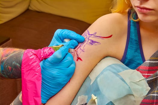the process of tattooing on the forearm close-up. High quality photo