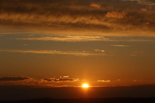 sky with late yellow sunset with clouds