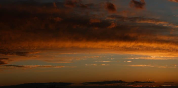 panoramic yellow sunset with clouds
