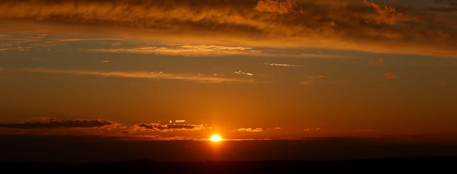 sky with late yellow sunset with clouds