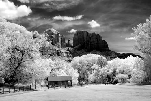 Infrared Black and white cathedral rock and old farm buildings Sedona Arizona