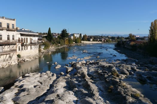 A body of water with a city in the backgroundundefined