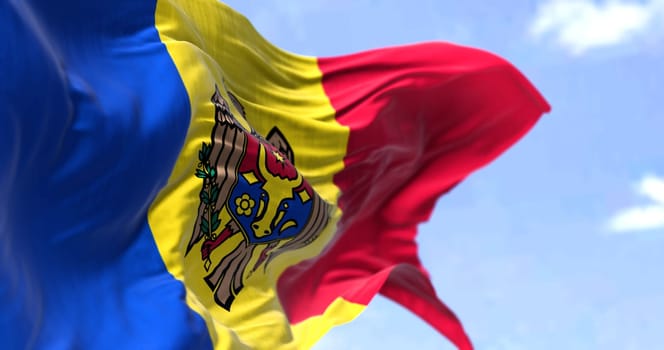 Detail of the national flag of Moldova waving in the wind on a clear day. Moldova is a sovereign state in Eastern Europe. Selective focus.