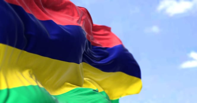 Detail of the national flag of Mauritius waving in the wind on a clear day. Mauritius is an island nation in the Indian Ocean. Selective focus.