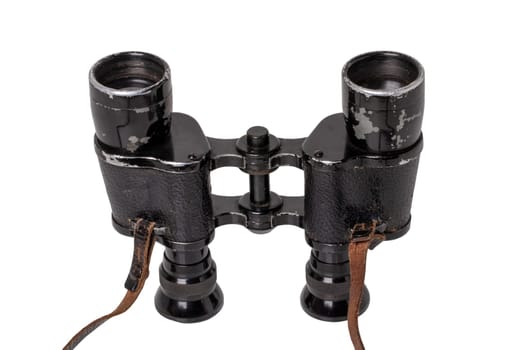 Vintage binoculars isolated. Close-up of an old german Binoculars with leather straps used from military during the second world war isolated on white. Macro.