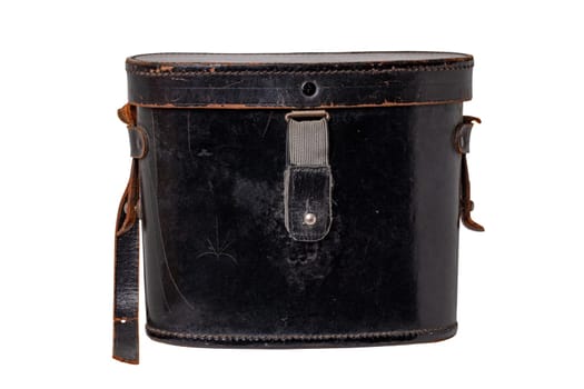 Vintage leather bag isolated. Close-up of a old black leather bag or trunk for a ancient German binoculars isolated on a white background. Macro.