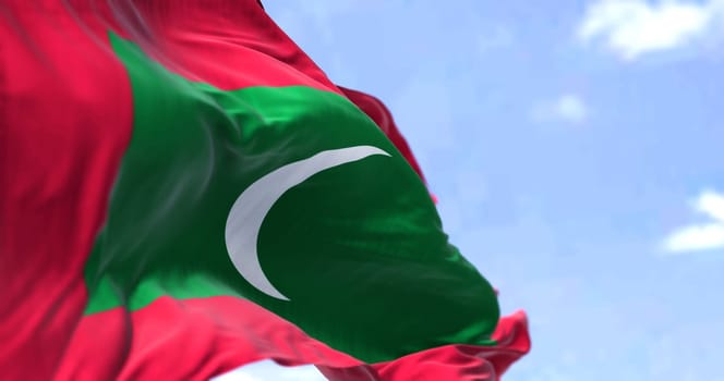 Detail of the national flag of Maldives waving in the wind on a clear day. Maldives is an archipelagic country in the Indian subcontinent of Asia. Selective focus.