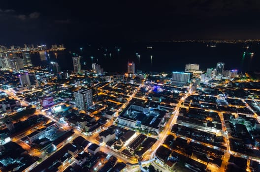 Georgetown, Penang, Malaysia - Jun 18 2017: Georgetown old heritage house and skyscraper in night view from high angle