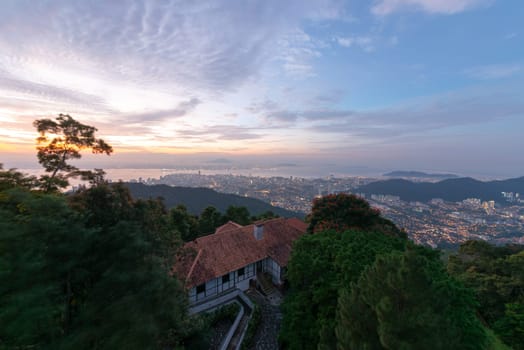 Georgetown, Kuala Lumpur, Malaysia - Jul 02 2017: Bungalow with background of Georgetown in sunrise dawn hour