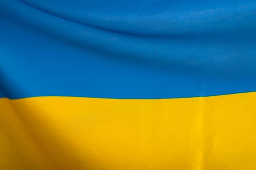 Flag of Ukraine. Blue and yellow colors. Close up shot, background