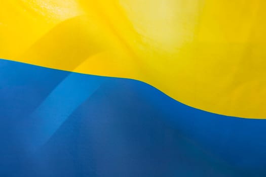 Flag of Ukraine, UA. Blue and yellow colors. Close up shot, background