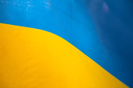 Flag of Ukraine, UA. Blue and yellow colors. Close up shot, background