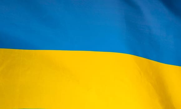 Flag of Ukraine. Blue and yellow colors. Close up shot, background