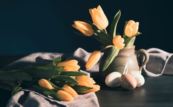 Beautiful Easter still life with fresh tulips and painted eggs