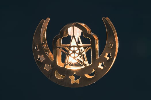 Ramadan Kareem background. Ornamental Arabic lantern glowing at night