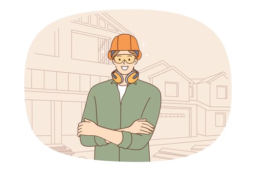 Smiling male constructor in protective gear at house construction site. Happy man engineer or housebuilder in helmet and headset at project yard control building. Flat vector illustration.