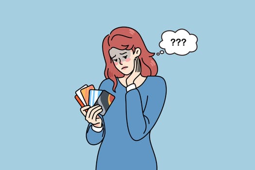 Unhappy woman holding credit cards feel confused with bank loan. Upset female client with deposit card distressed with bankruptcy or financial problems. Flat vector illustration.