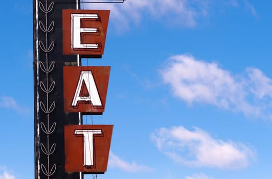 Advertising sign designed to tell you food is available here