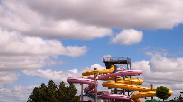 Multi Color splash tubes stand unused on a beautiful day at the Waterpark