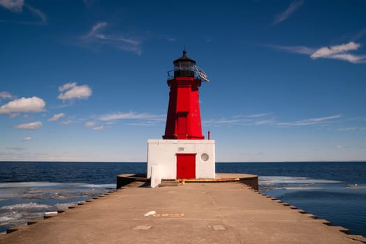 The Lighhouse stands not needed on a beautiful day in Lake Michigan