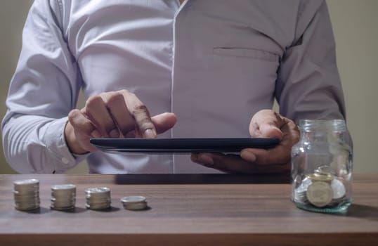 Online banking and internet banking and networking people and save money and account banking for finance concept, Business man with laptop and coin money