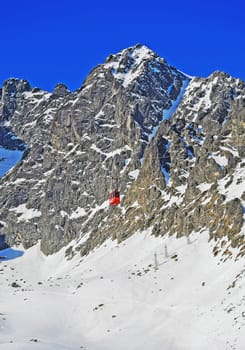 Mountains in winter with cable car