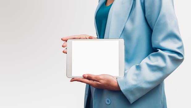Young business woman holding and show screen digital technology tablet computer on her hand isolated white background
