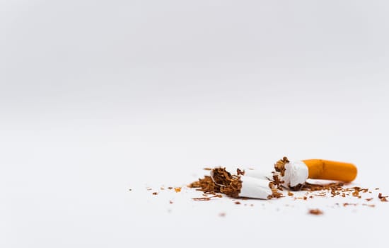 31 May of World No Tobacco Day, no smoking, close up of broken pile cigarette or tobacco STOP symbolic on white background with copy space, and Warning lung health concept