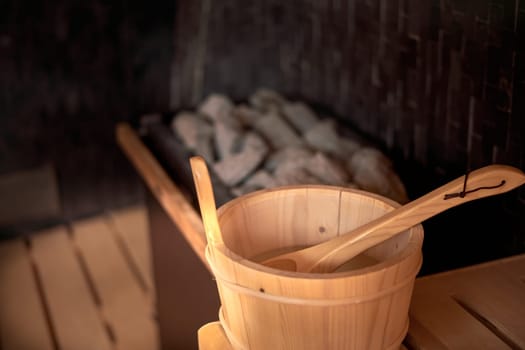 Sauna bucket in hot cosy sauna room - no people.