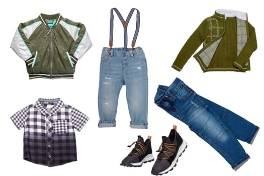 Collage set of little boys spring clothes isolated on a white background. Denim trousers or pants, a pair of shoes, a rain jacket, shirts and jumpers for child boy. Children's autumn and winter fashion.