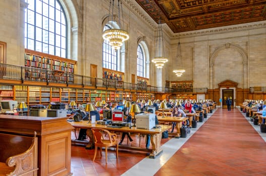 People and students sitting in a large Hall in the New York Public Library to read and learn, left side, NYC, United States, Horizontal