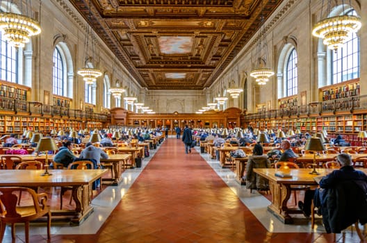 People and students sitting in a large Hall in the New York Public Library to read and learn, NYC, United States, Horizontal