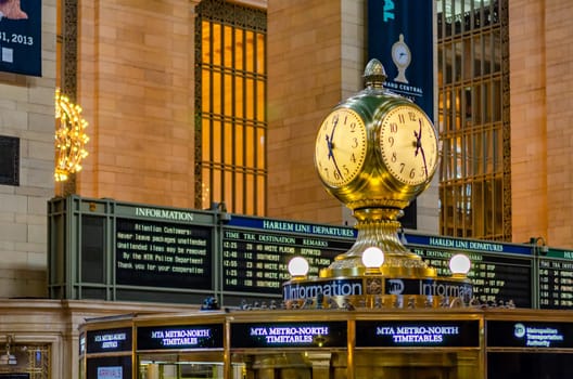 Grand Central Station New York indoors yellow Clock with Timetables and scoreboard in the background, view from low angle