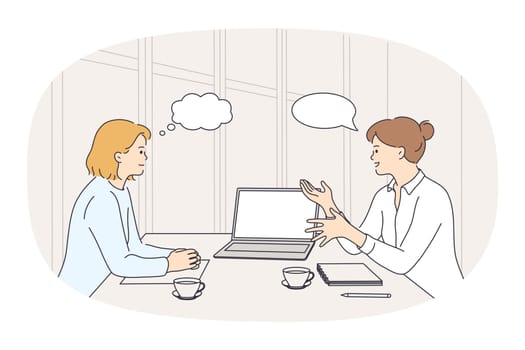 Businesswomen sit at desk talk brainstorm at office meeting. Female colleagues or business partners have negotiations or briefing. Empty copy space in speech bubble. Vector illustration.