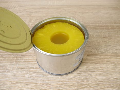 A can of pineapple slices in juice