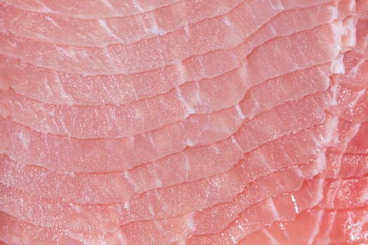 Closeup top view pieces raw meat of fresh pork slices are sliced into thin strips stacked on top of each other