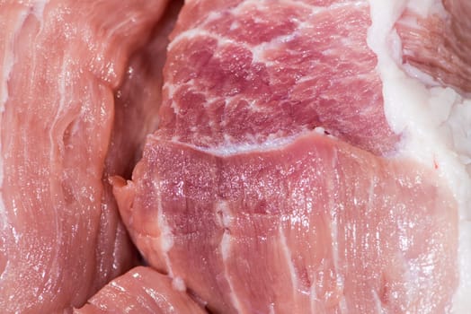 Closeup top view piece fresh raw meat of pork