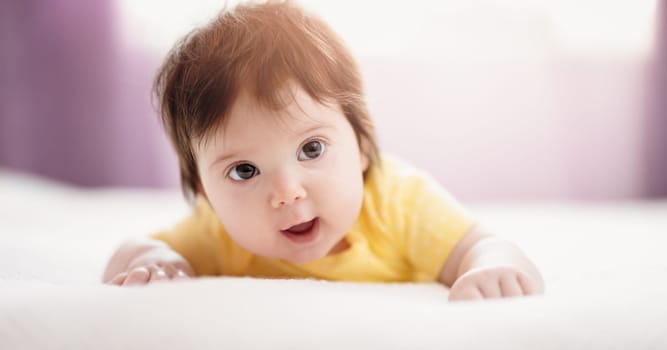 Cute little baby lying on the blanket. Concept of childhood and new life.